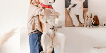 Woman Carrying her Dog